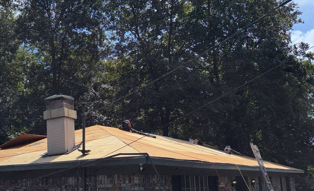 A roof stripped to the plywood deck during a re-roof in Semmes, Alabama